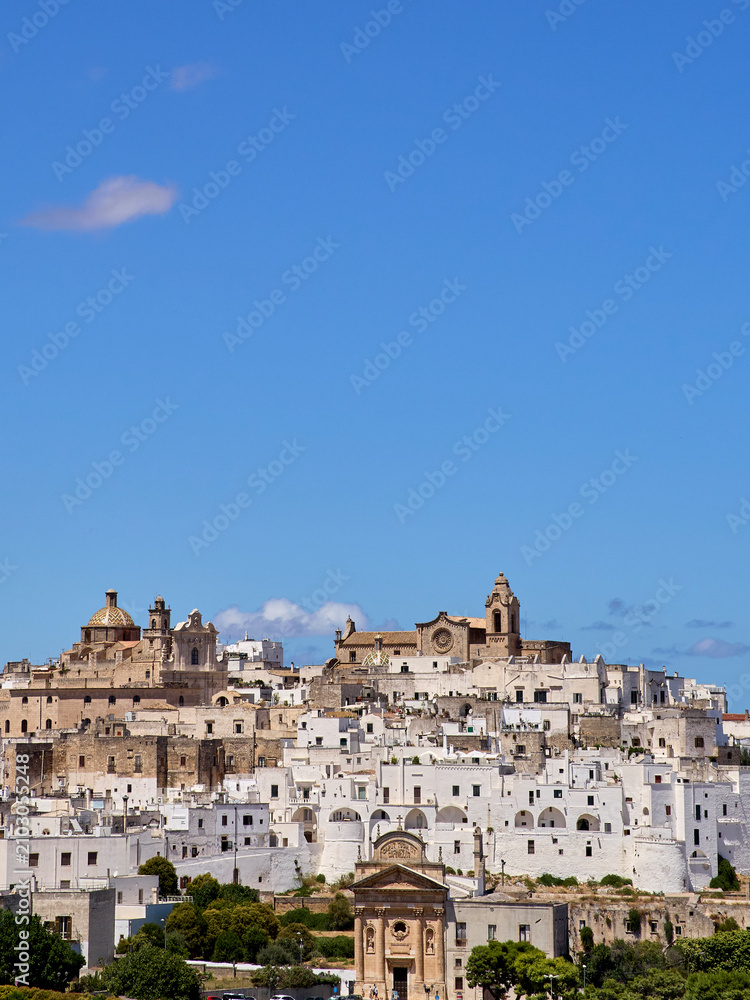 Fototapeta premium Panoramic view of Ostuni, also known as the White City. Province of Brindisi. Apulia, Puglia, Italy, Europe