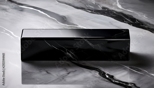 A Sleek Black Rectangular Object On Marble