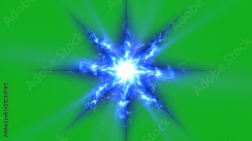 A bright blue glowing star with sharp rays on a green background
