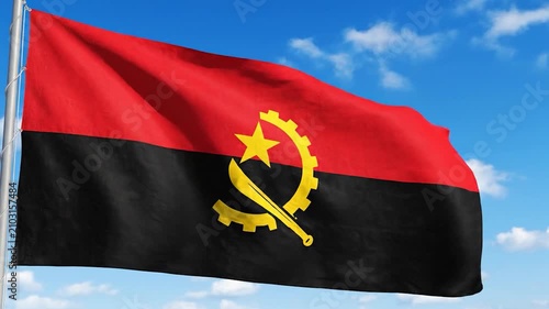 The national flag of Angola waving against a clear blue sky