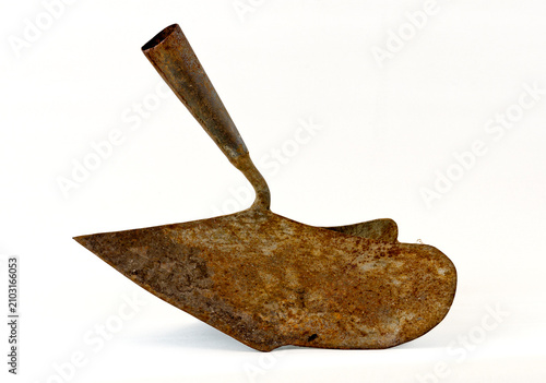 Old rosty iron hand plough on white background