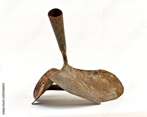Old rosty iron hand plough on white background