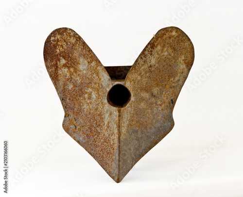 Old rosty iron hand plough on white background