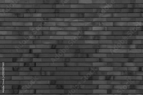 Cuadro en lienzo Black clinker brick wall with smooth rectangular bricks and dark thin seams