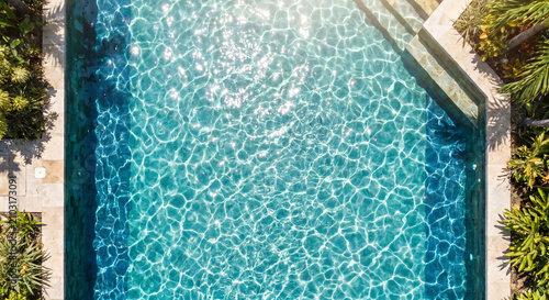 Tropical Swimming Pool with Clear Blue Water and Lush Surroundings