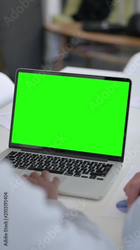 Rear View of Business People using Laptop with Green Chroma Screen, Vertical Video