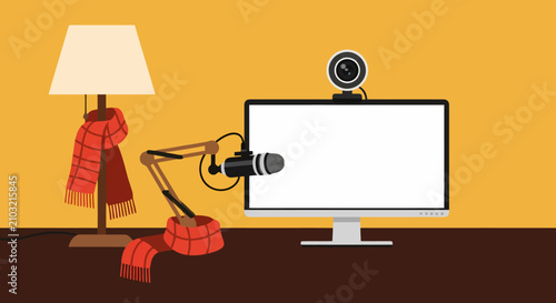 Cozy home podcasting studio setup with computer screen, microphone, webcam, and warm winter scarves on desk.