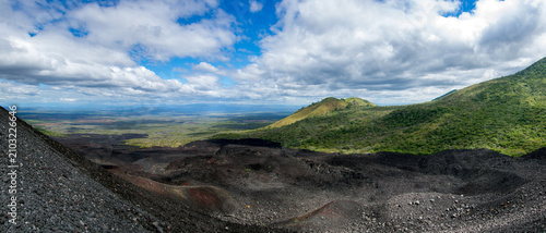 Panoramic view from the active Cerro Negro volcano overlooking the lush green hills of the Maribios mountain range and vast plains in Leon, Nicaragua