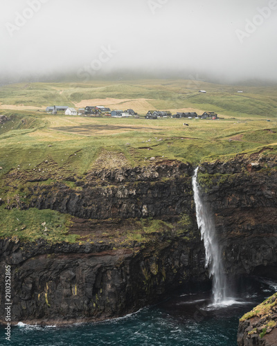 Mulafossur Waterfall Cascading into the Ocean, Gasadalur, Faroe Islands