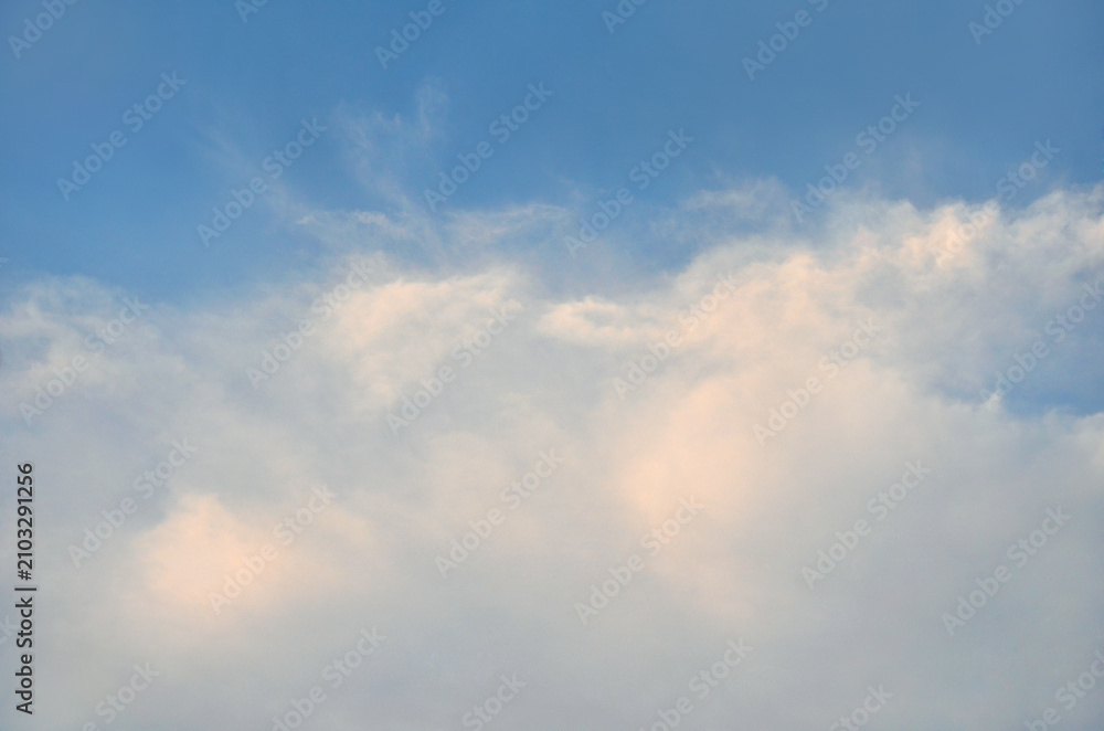 Obraz premium Serene blue sky with soft wispy clouds in the bottom drifting against calm and peaceful sky landscape.