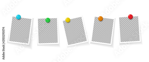 Foto Five blank instant photo frames with transparent centers, each secured by a colorful pushpin, creating a casual memory board for cherished moments and creative content