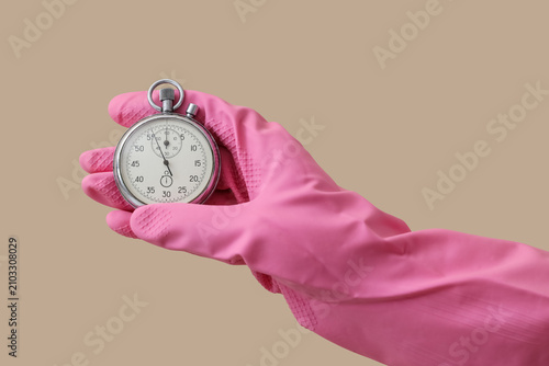 Hand in pink rubber glove h...