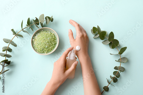 Woman applying hand cream f...