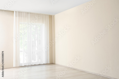 Empty room with light beige...