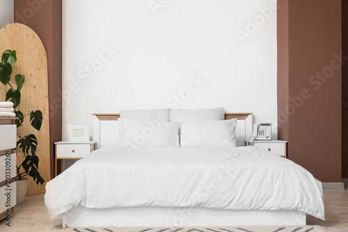 Interior of light bedroom w...