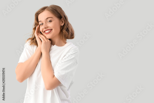 Smiling young woman with bo...