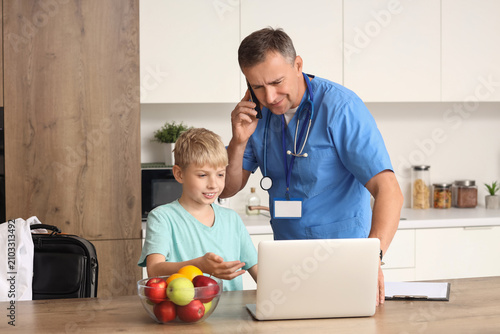 Busy mature doctor and his ...