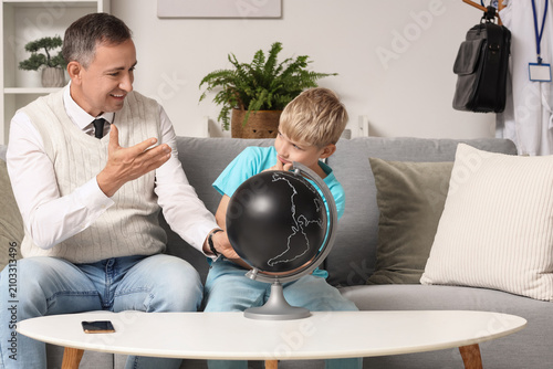 Mature doctor with his litt...