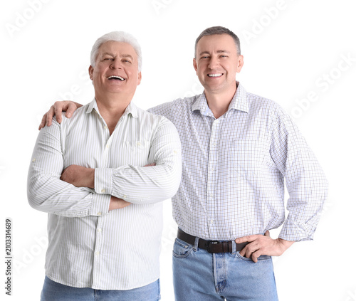 Mature brothers on white ba...