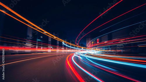Colorful light trails from traffic on a busy city highway at night