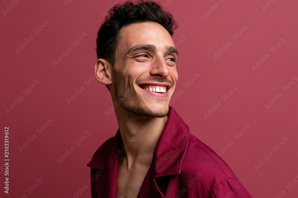 Obraz premium Smiling man portrait with red background and open collar shirt for lifestyle banner and editorial design