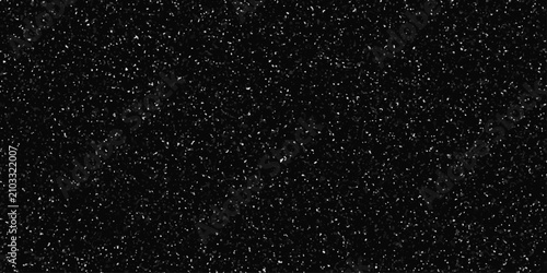 Minimalist white and black speckle texture, terrazzo flooring consists of chips of marble texture. random ink dots, black background, subtle grain pattern, abstract monochrome design.