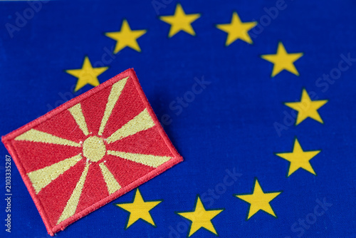 Fotografie North Macedonia accession to the European Union concept with Macedonian national flag patch on EU flag background