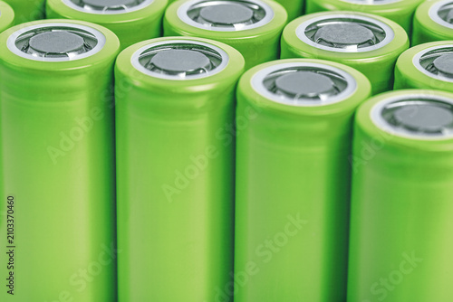 Close-up of green lithium batteries. copy space