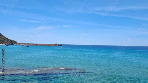 Panoramic view of Mediterranean sea resort in Calp, transparent clear blue water on a sunny summer day, travel and vacation concept, 4K.