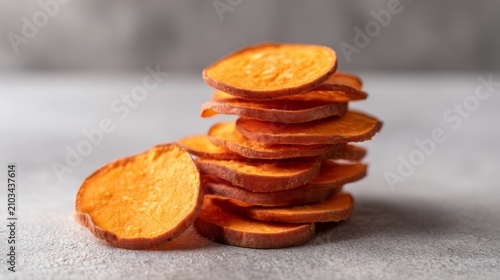 Freshly Sliced Sweet Potato Stacked on Gray Surface with Soft Light