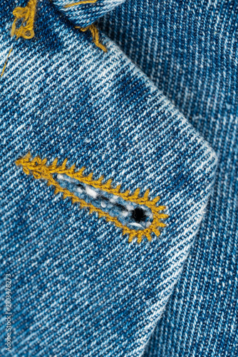 Quadro su tela Close-up of buttonhole in blue denim fabric