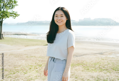 Smiling young asian woman s...