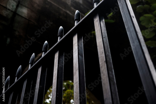 фотографія Black iron fence showing security and boundary concept