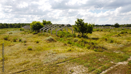 Schilderij op canvas A high-angle drone photograph capturing the concrete skeleton frames of long-aba