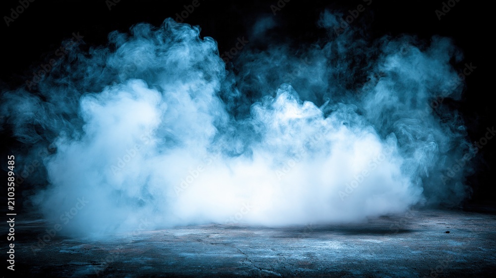 Fototapeta premium Soft wispy light blue smoke or fog hovering over textured concrete ground against solid dark black background creates dramatic atmospheric effect