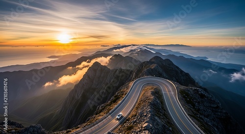 Dramatic sunset over rugged mountain landscape.