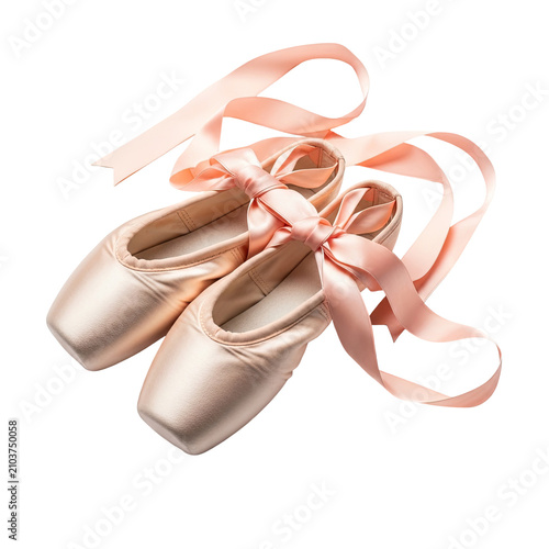 Pair of satin ballet pointe shoes with silk ribbons isolated on white background.