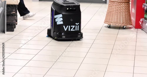 An unmanned cleaning robot cleans a shopping center in a supermarket in Riga, Latvia, on July 9, 2026