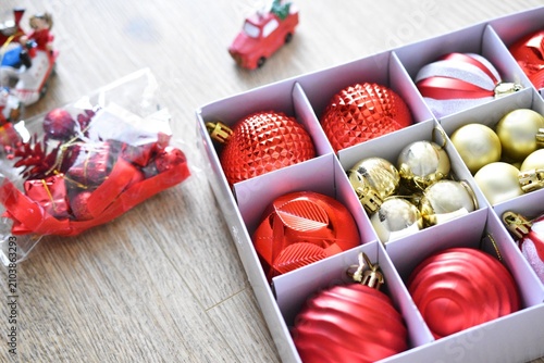 box with red and golden christmas decorations 