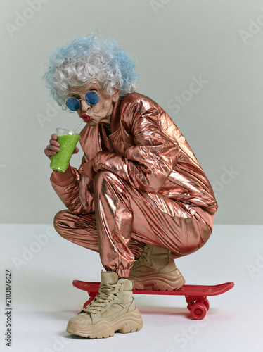  stylish elderly woman with voluminous curly white-silver hair