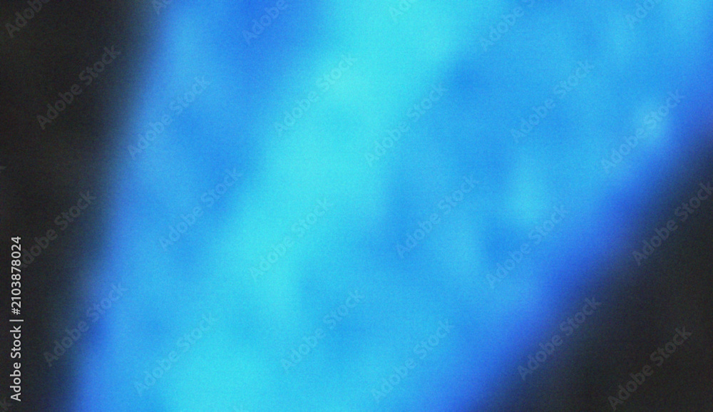 Fototapeta premium Deep ocean blue light creates a cool and calming abstract ripple effect with subtle textured grain