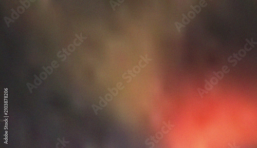 Foto Ethereal blend of warm red and golden light with a soft textured grain, suitable