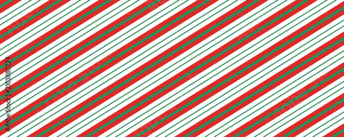 Candy cane background. Diagonal stripes seamless pattern. Peppermint wrapping texture. Red candy cane stripes. Vector illustration