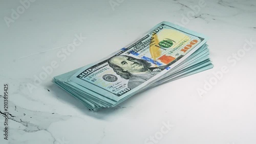 Rotating Stack of 100 Dollar Bills 360 Degree Turntable Close Up Cash Money Investment Wealth Concept 4K