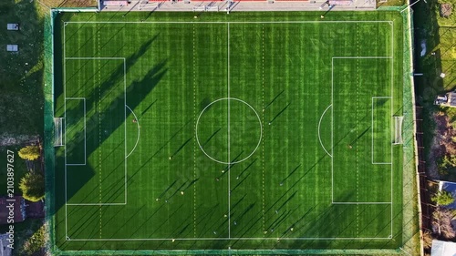 Outdoor football practice on suburban grass pitch
