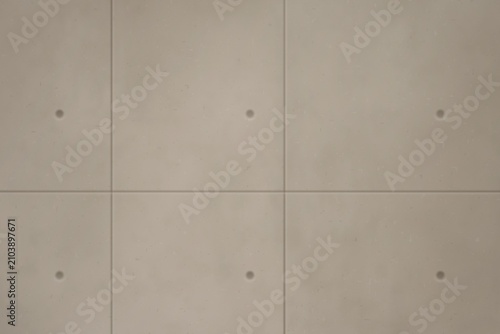 Tableau sur toile Concrete wall with grid pattern and circular indentations