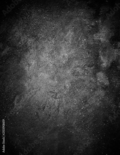 фотографія Black grunge concrete wall texture background with subtle light spot concrete ba