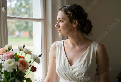 Thoughtful young woman in a...