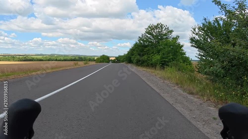 Gravel bicycle ride on the road in the summer season