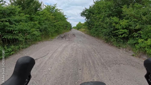 Gravel bicycle ride on the road in the summer season